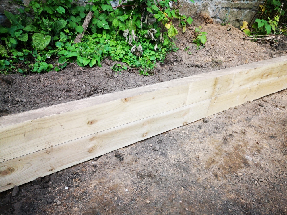 timber framing on mucky garden